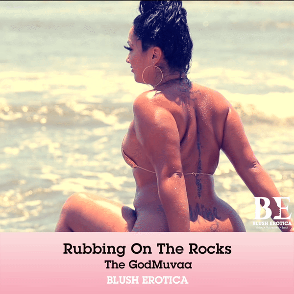 The GodMuvaa sitting on an ocean rock